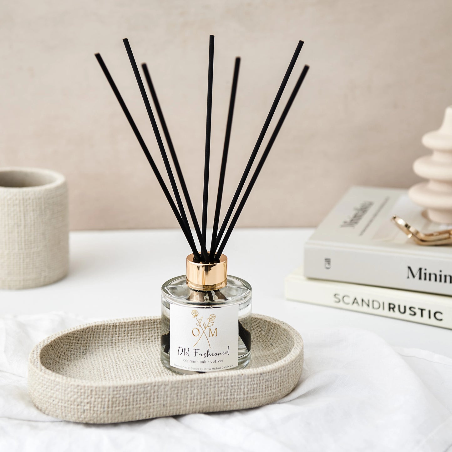 Our cognac and oak diffuser is on display in a clear glass jar.