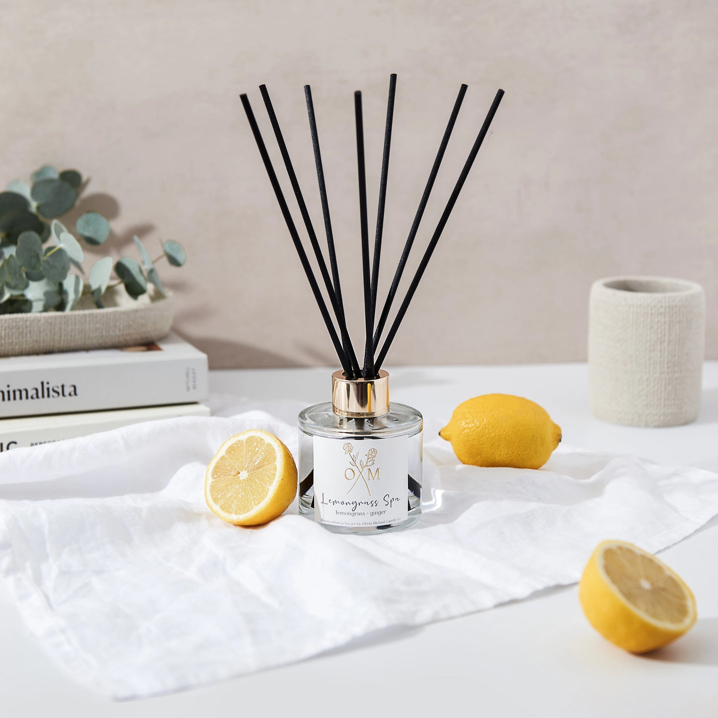 Our lemongrass and ginger diffuser is on display in a clear glass jar.